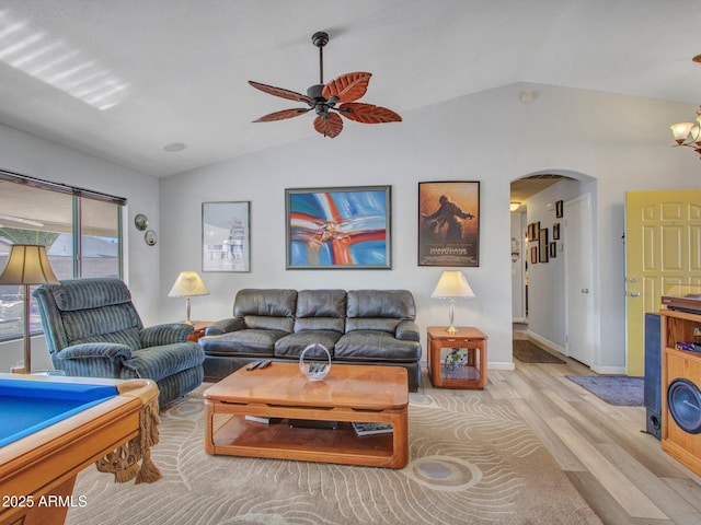 living room featuring light hardwood / wood-style flooring, ceiling fan, and vaulted ceiling