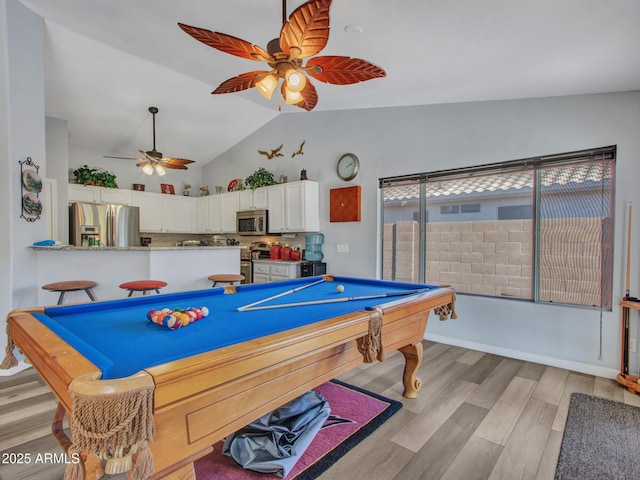 rec room featuring lofted ceiling, light hardwood / wood-style flooring, ceiling fan, and billiards