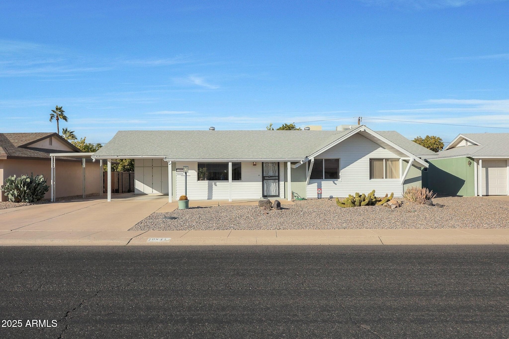 single story home with a carport