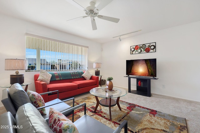 carpeted living room with ceiling fan and track lighting