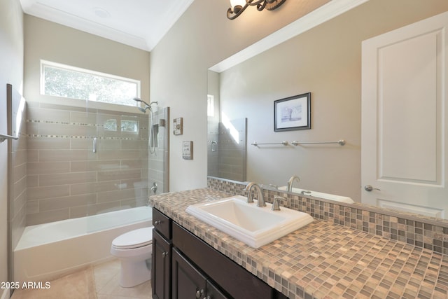 bathroom with tile patterned flooring, toilet, vanity, shower / bathing tub combination, and crown molding