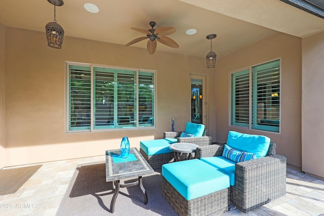 view of patio / terrace with an outdoor living space and a ceiling fan