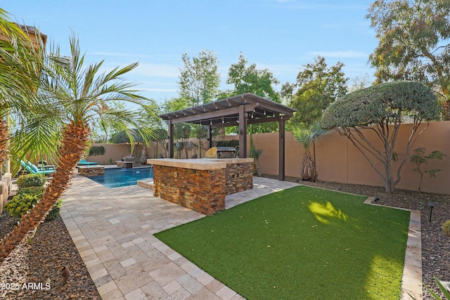 view of patio / terrace featuring a fenced in pool, a fenced backyard, an outdoor bar, and an outdoor kitchen