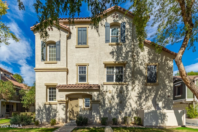 mediterranean / spanish-style home featuring a garage