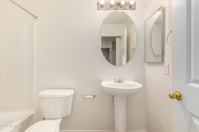 bathroom with toilet and sink