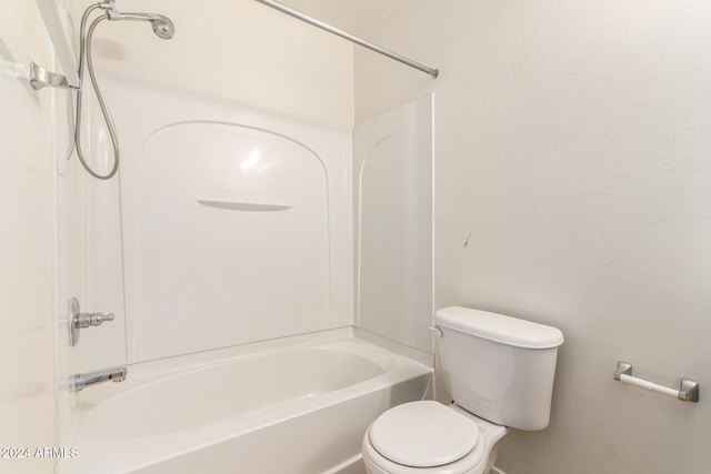 bathroom featuring toilet and shower / bathtub combination