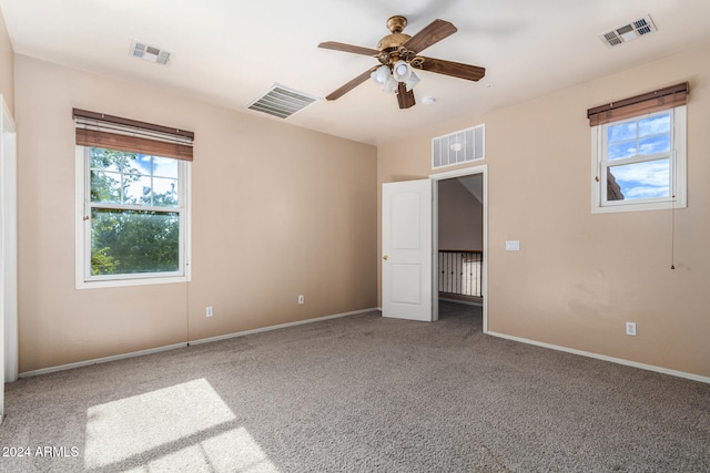 unfurnished bedroom featuring ceiling fan and carpet floors