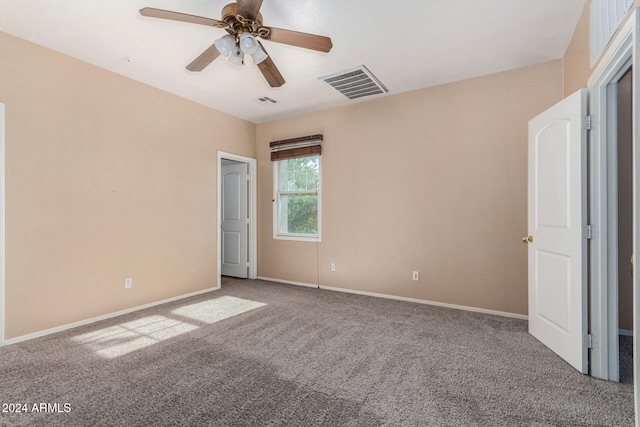 unfurnished bedroom with carpet flooring and ceiling fan