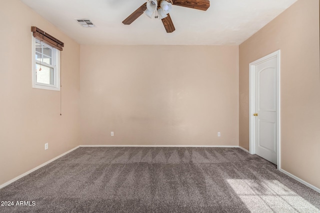 spare room featuring carpet flooring and ceiling fan