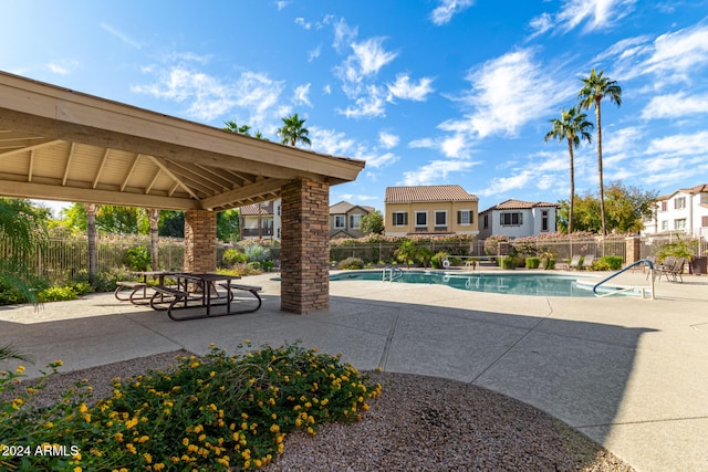 view of pool featuring a gazebo and a patio