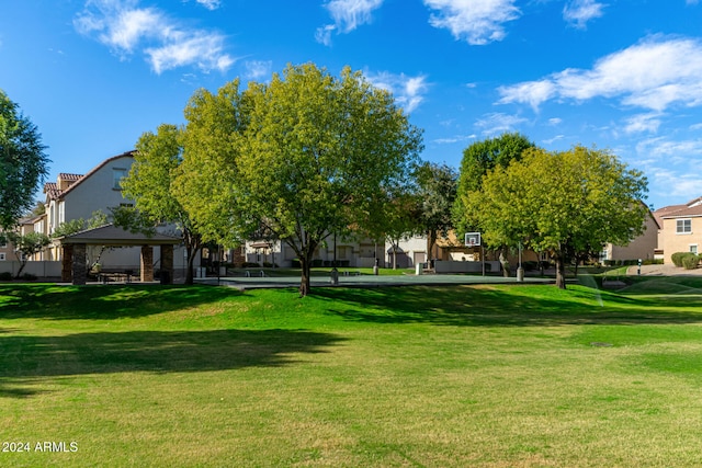 view of property's community with a gazebo and a yard