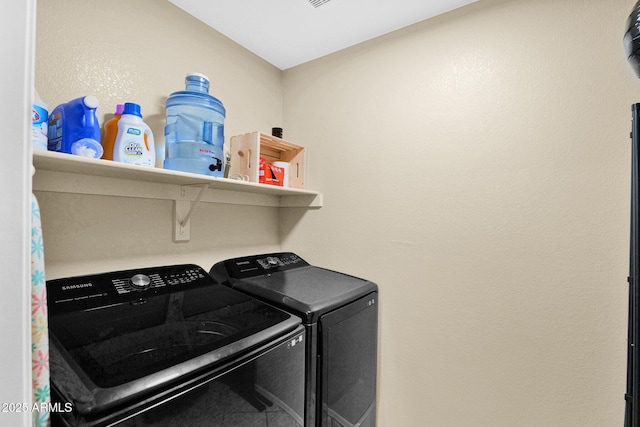 washroom featuring washing machine and dryer