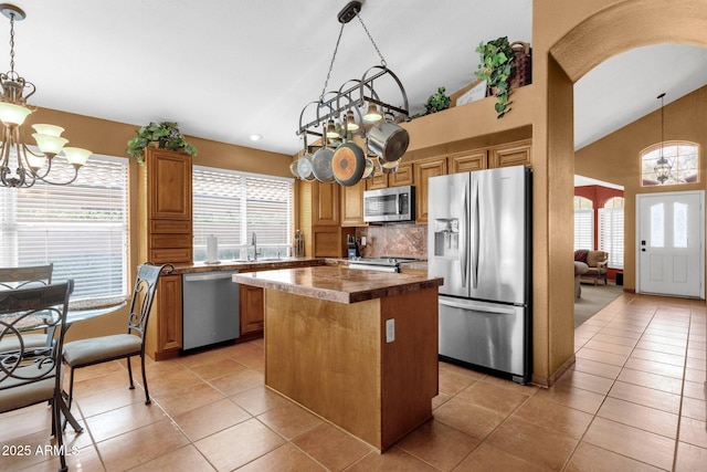 1558 W Maplewood St, Chandler, AZ 85286 - kitchen with appliances with stainless steel finishes, a chandelier, a center island, plenty of natural light, and high vaulted ceiling