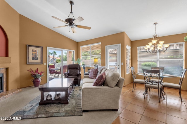 1558 W Maplewood St, Chandler, AZ 85286 - living area with a chandelier, a fireplace, vaulted ceiling, a ceiling fan, and light tile patterned floors
