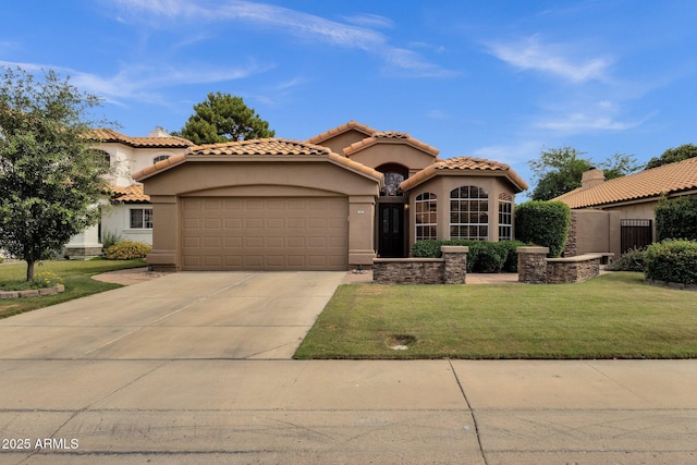1558 W Maplewood St, Chandler, AZ 85286 - mediterranean / spanish-style home featuring a garage, stucco siding, concrete driveway, and a front yard