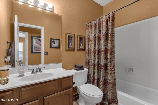 1558 W Maplewood St, Chandler, AZ 85286 - bathroom featuring vanity, toilet, shower / tub combo, and a textured wall