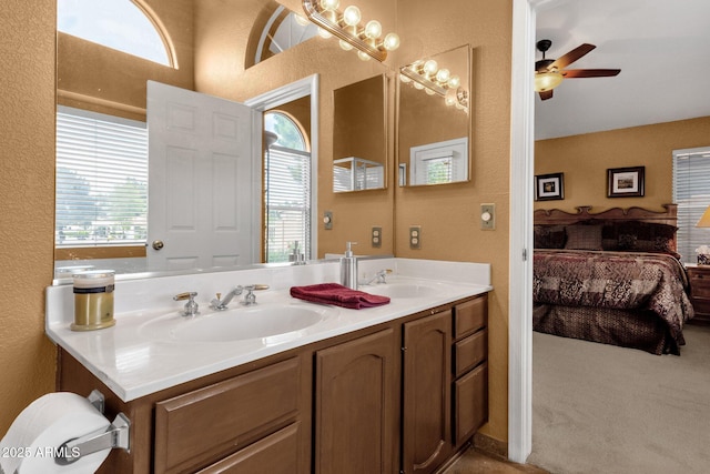 1558 W Maplewood St, Chandler, AZ 85286 - ensuite bathroom with double vanity, a textured wall, and ceiling fan
