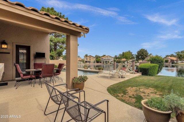 1558 W Maplewood St, Chandler, AZ 85286 - view of patio with a water view and an infinity pool