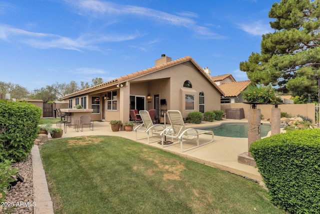 1558 W Maplewood St, Chandler, AZ 85286 - back of house with a chimney, a tiled roof, a patio, and stucco siding