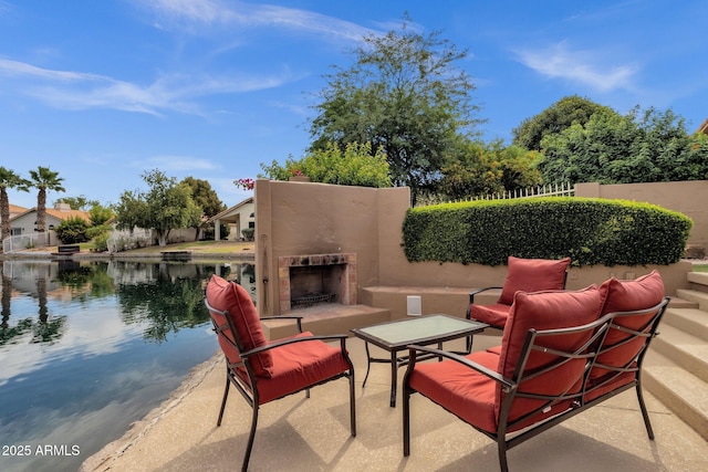 1558 W Maplewood St, Chandler, AZ 85286 - view of patio / terrace with an outdoor fireplace and a water view