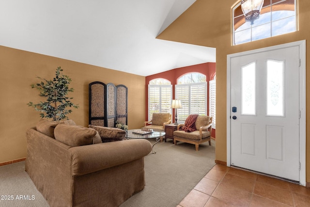 1558 W Maplewood St, Chandler, AZ 85286 - entryway with lofted ceiling, light tile patterned floors, baseboards, and light colored carpet