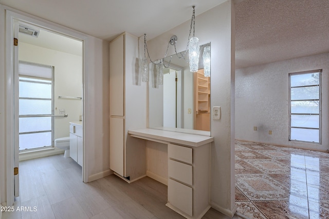 bathroom featuring hardwood / wood-style floors, vanity, and toilet