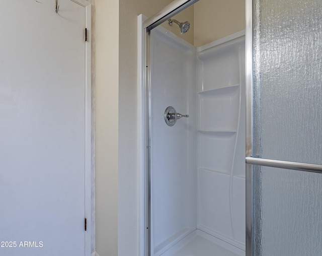 bathroom featuring an enclosed shower