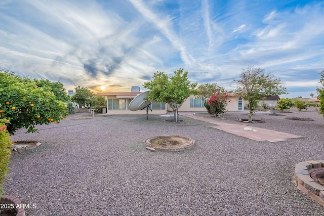 exterior space featuring a patio and a fire pit