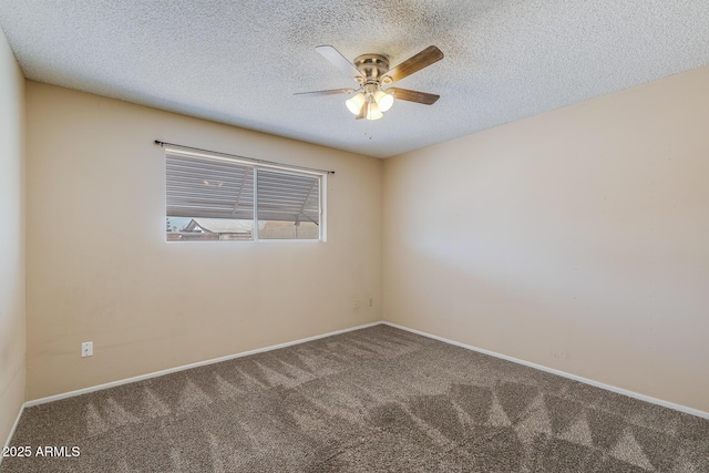 empty room featuring a textured ceiling, carpet, a ceiling fan, and baseboards