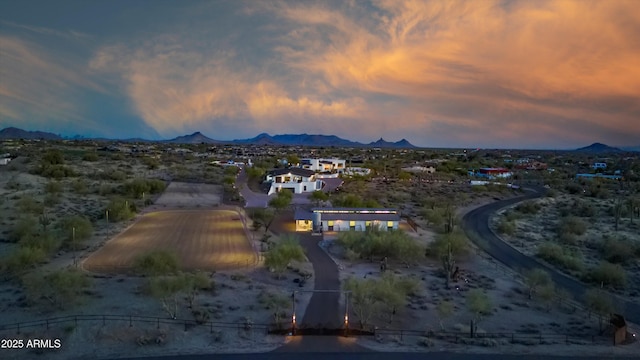 birds eye view of property featuring a mountain view