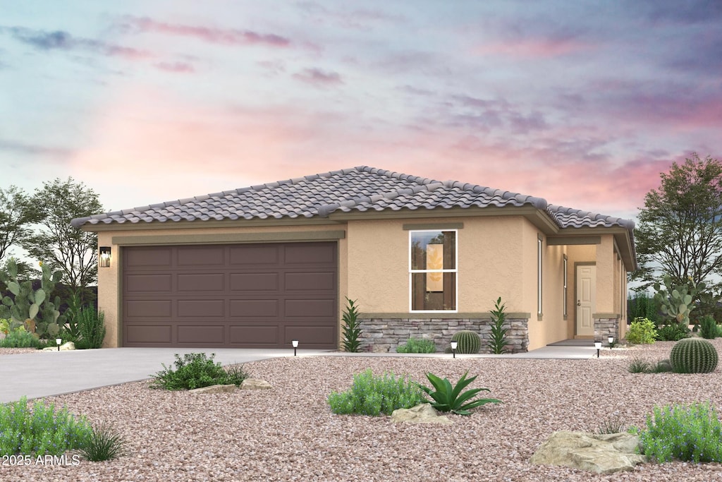 1113 N 13th St, Coolidge, AZ 85128 - view of front facade with a garage, driveway, stone siding, a tiled roof, and stucco siding
