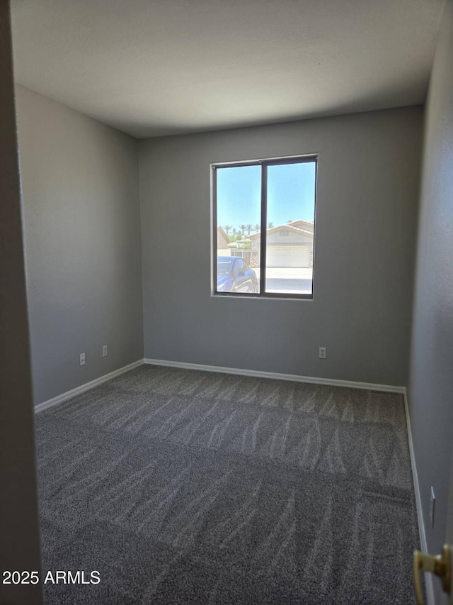 14621 W Catalina Dr, Goodyear, AZ 85395 - empty room with dark colored carpet