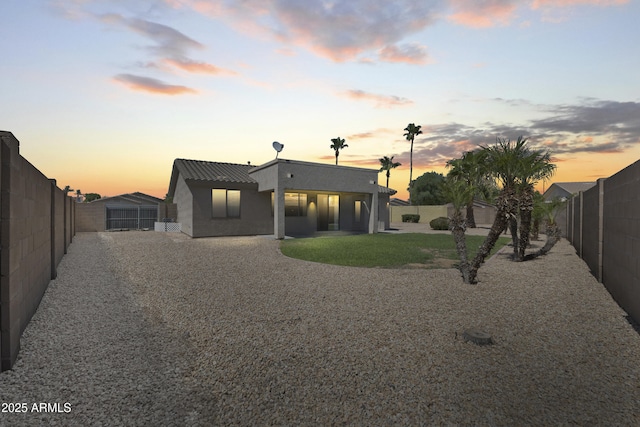14621 W Catalina Dr, Goodyear, AZ 85395 - rear view of property with stucco siding, a fenced backyard, and a patio area