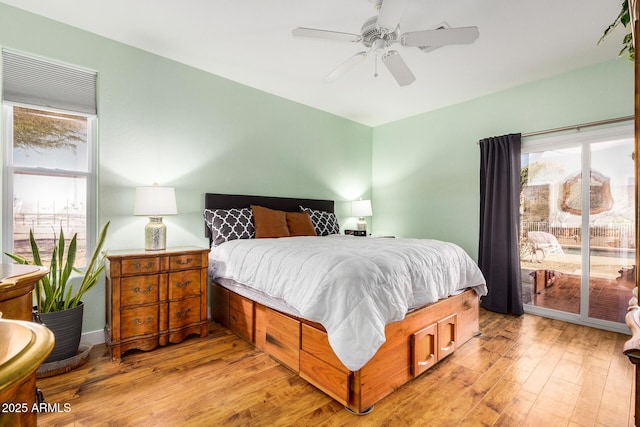 bedroom featuring ceiling fan, access to outside, and light wood finished floors