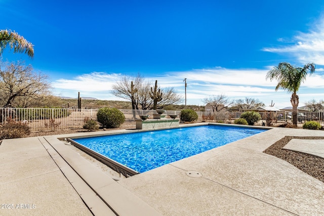 view of swimming pool with a patio area, fence, and a fenced in pool