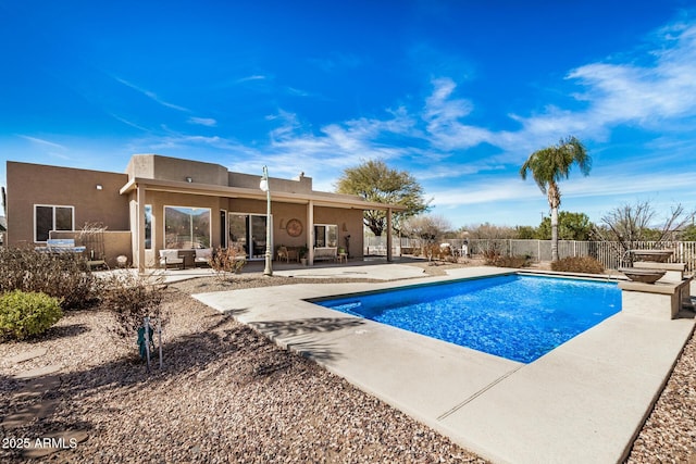 view of pool featuring a patio, fence, and a fenced in pool