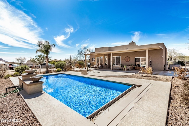 view of pool featuring a patio area, fence, and a fenced in pool