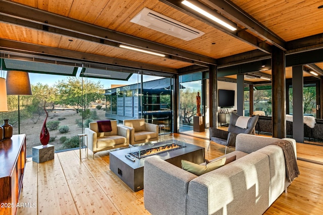 sunroom / solarium featuring beam ceiling