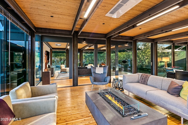 sunroom / solarium featuring wood ceiling and beamed ceiling