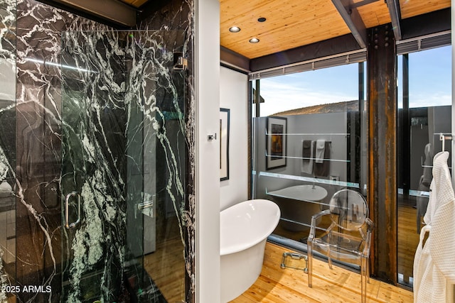 bathroom with plus walk in shower, wood-type flooring, and wood ceiling