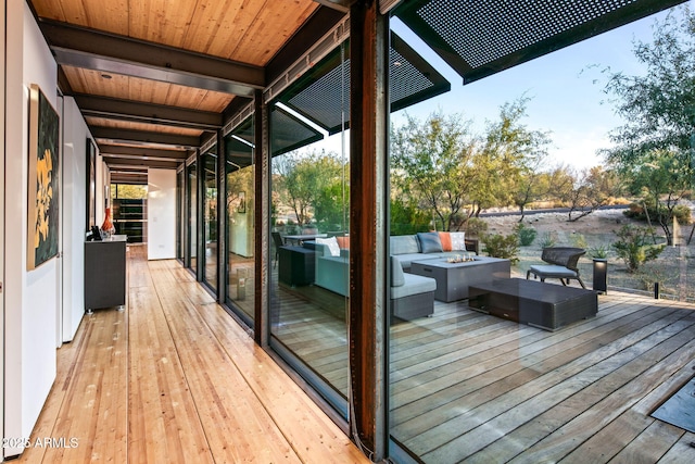 deck featuring an outdoor fire pit