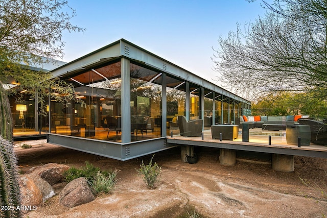 rear view of house featuring an outdoor living space