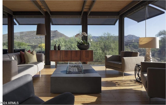 sunroom / solarium with a mountain view