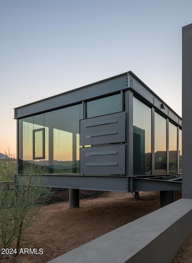 view of property exterior at dusk