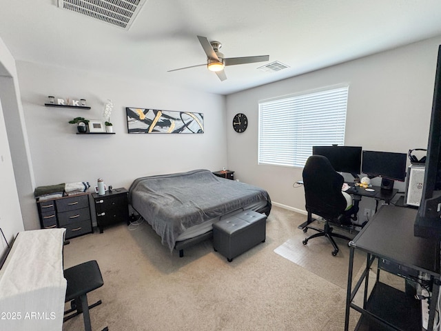 bedroom featuring ceiling fan, visible vents, and light colored carpet