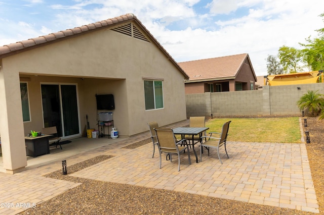 view of patio / terrace featuring outdoor dining area and fence