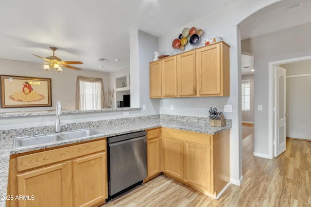 kitchen featuring a healthy amount of sunlight, dishwasher, sink, and light brown cabinets