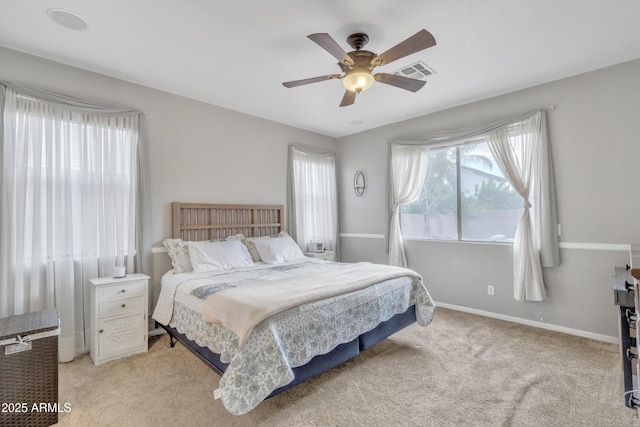 bedroom with light colored carpet and ceiling fan