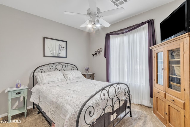 bedroom with light colored carpet and ceiling fan