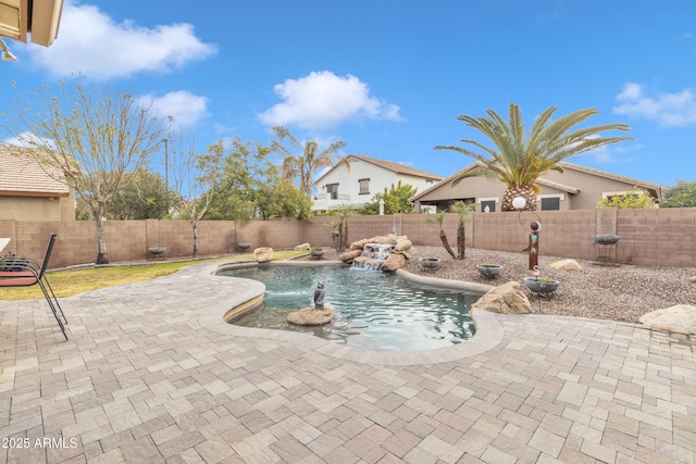 view of swimming pool featuring pool water feature and a patio area